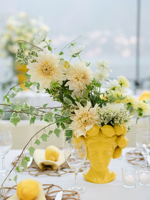 Yellow dahlias in a lemon vase